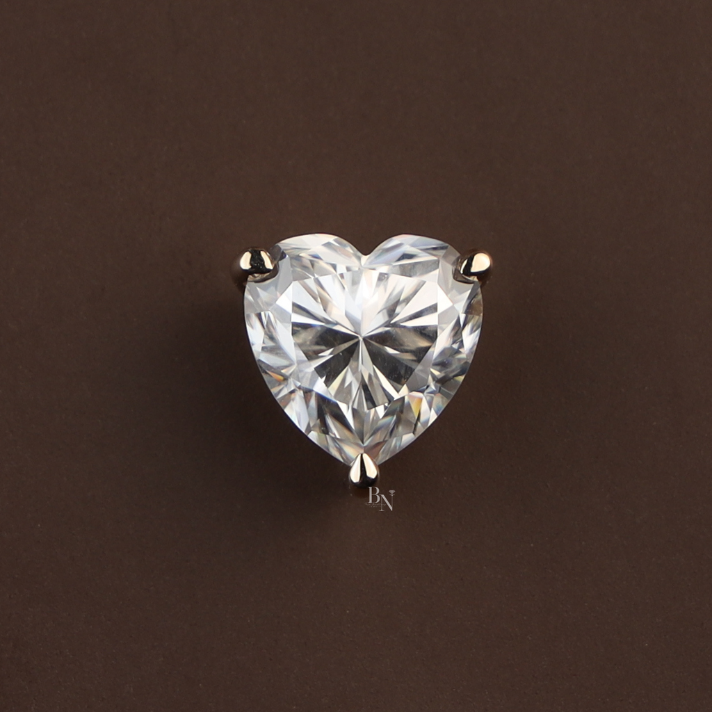 Heart-shaped moissanite solitaire pendant featuring a 6 carat brilliant cut stone in a 14k yellow gold three-prong setting, displaying maximum rainbow fire, kaleidoscopic brilliance, and high refractive sparkle.