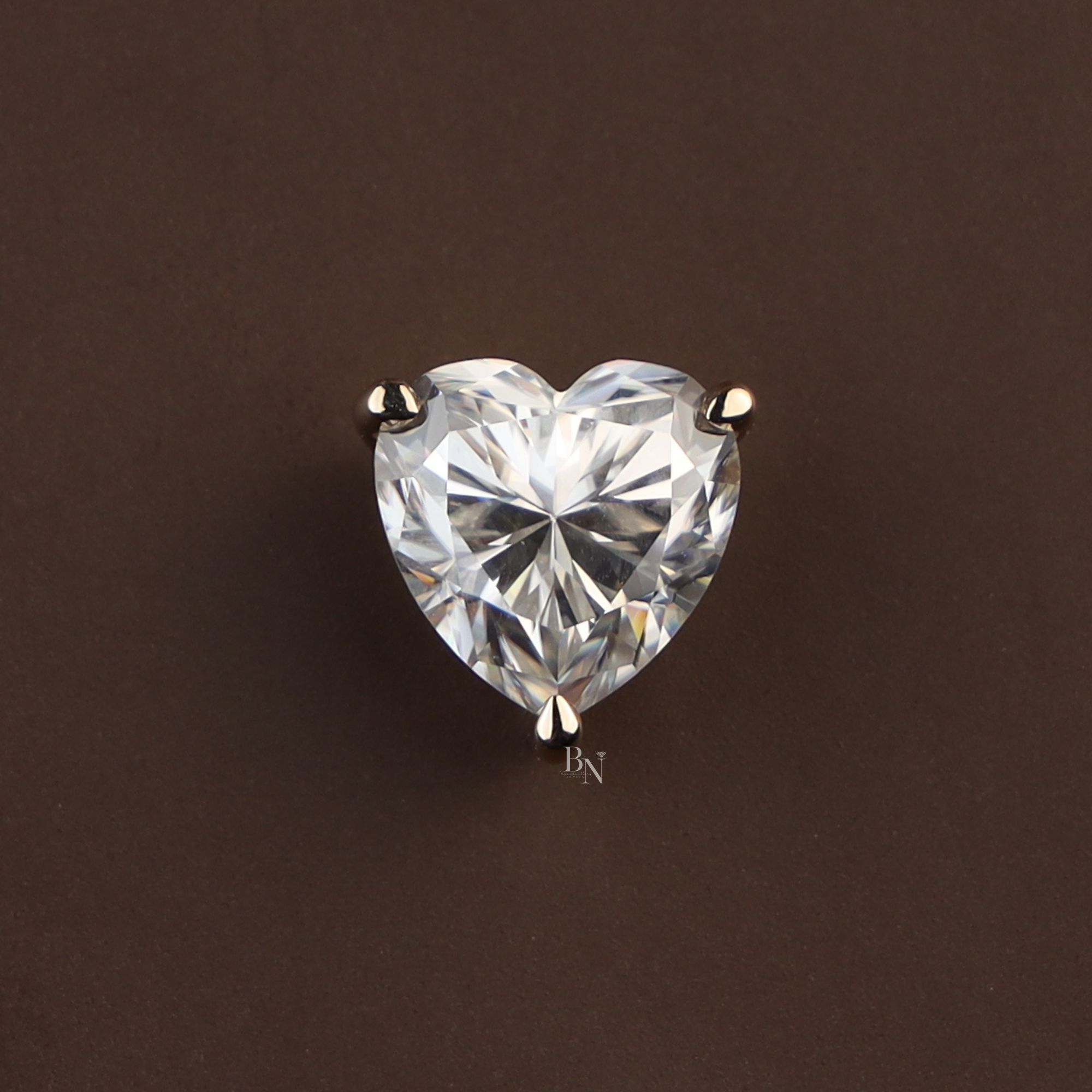 Heart-shaped moissanite solitaire pendant featuring a 6 carat brilliant cut stone in a 14k yellow gold three-prong setting, displaying maximum rainbow fire, kaleidoscopic brilliance, and high refractive sparkle.
