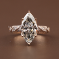 3 carat marquise cut lab grown diamond engagement ring with twisted vine rose gold band featuring intricate milgrain detailing and sparkling side stones.