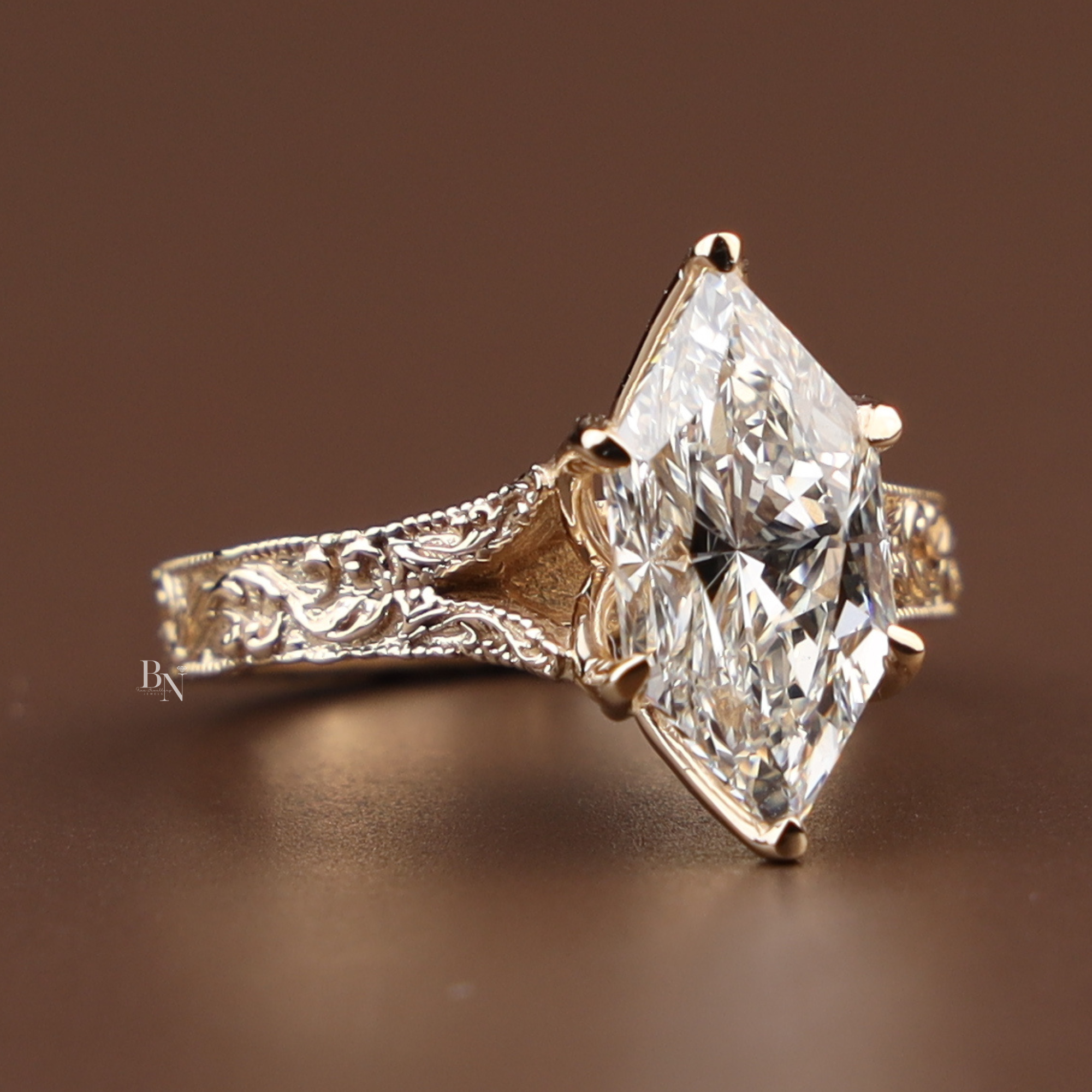 3 carat dutch marquise lab grown diamond engagement ring in 14k yellow gold with intricate engraved filigree band, vintage inspired statement ring for proposal.