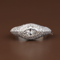 2 carat marquise cut lab grown diamond engagement ring in 14k white gold featuring a shimmering hidden halo and tapered pave diamond band with a high profile cathedral setting and pave bridge detail.