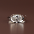 Three carat oval lab grown diamond engagement ring in a heavy platinum molten metal signet setting featuring an east west oriented fluid wavy bezel band design shown from the top profile and inside a black ring box.