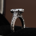 3 carat marquise cut lab grown diamond engagement ring in an antique inspired setting with intricate engraved scrollwork on the band and delicate milgrain detail.
