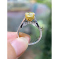 Cushion Cut Fancy Yellow Lab Grown Diamond Engagement Ring with a Twisted Pave Infinity Band in 14k Two-Tone Solid Gold.