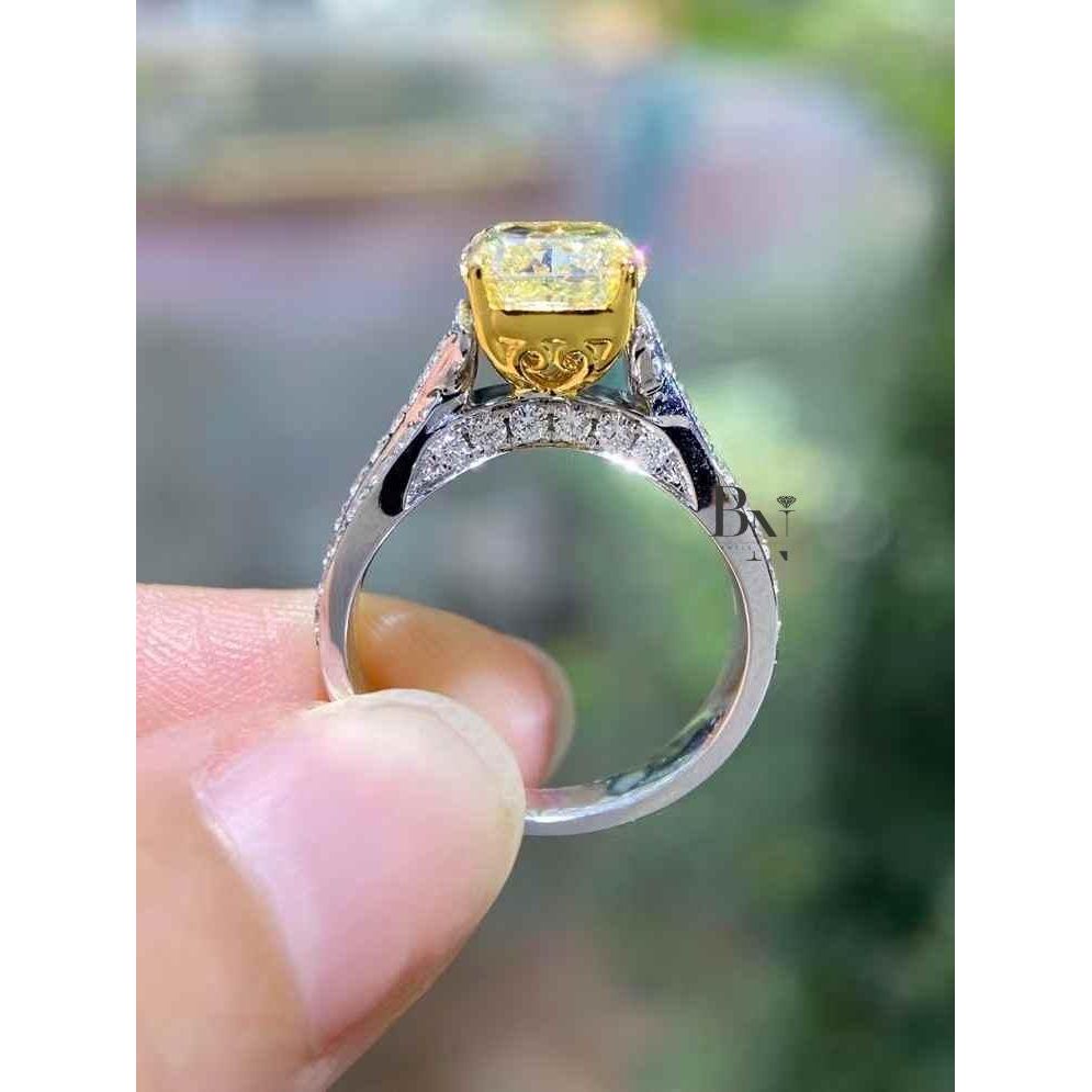 Cushion Cut Fancy Yellow Lab Grown Diamond Engagement Ring with a Twisted Pave Infinity Band in 14k Two-Tone Solid Gold.