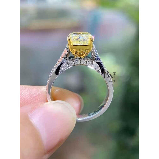 Cushion Cut Fancy Yellow Lab Grown Diamond Engagement Ring with a Twisted Pave Infinity Band in 14k Two-Tone Solid Gold.