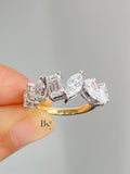1.50 TCW multi-shape lab grown diamond wedding band with a mix of cuts including emerald and pear in a two-tone setting.