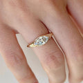 Hand-model view of 1.2 carat Marquise Cut Lab Grown Diamond ring set horizontally (East-West) in a half-bezel tension style on a sleek, high-polish yellow gold band.