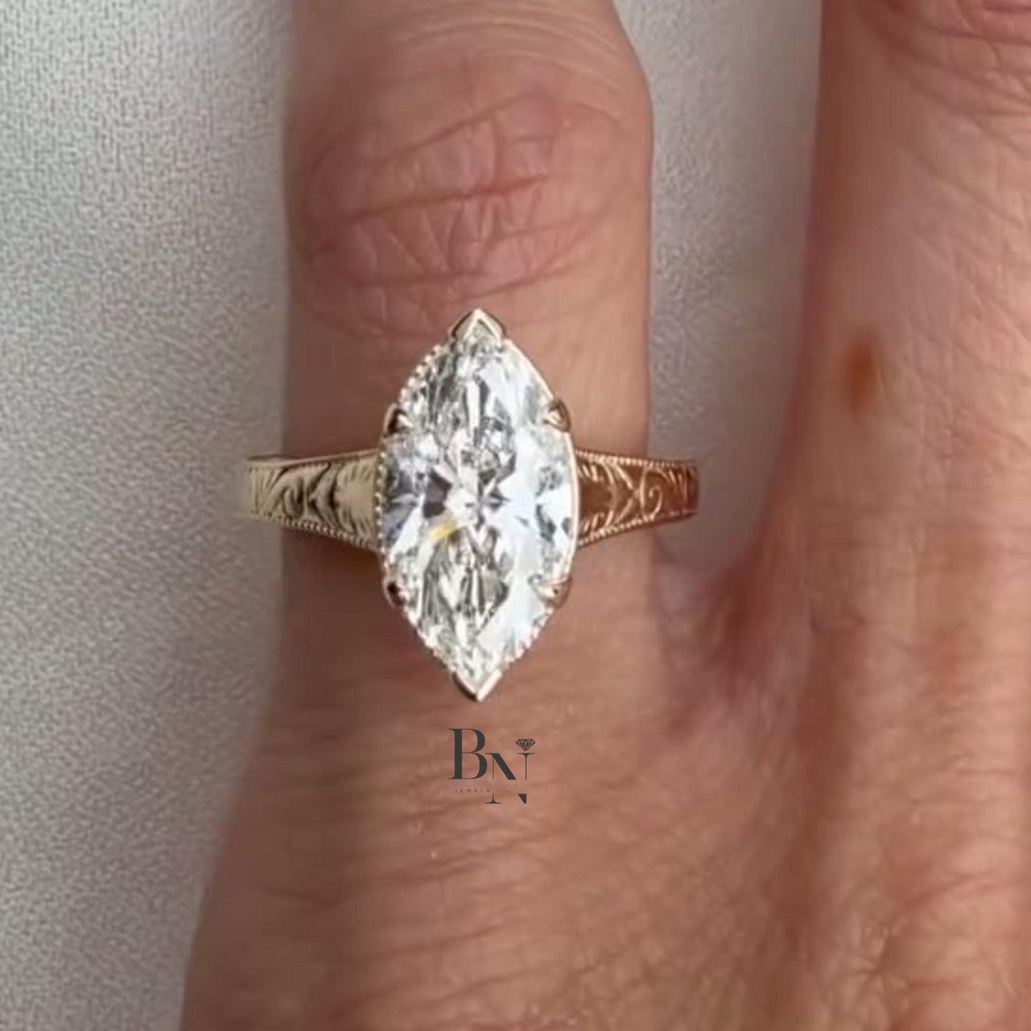 3.00 carat marquise lab diamond solitaire in yellow gold, featuring an antique bezel setting and vintage hand-engraved filigree band for an Art Deco look.