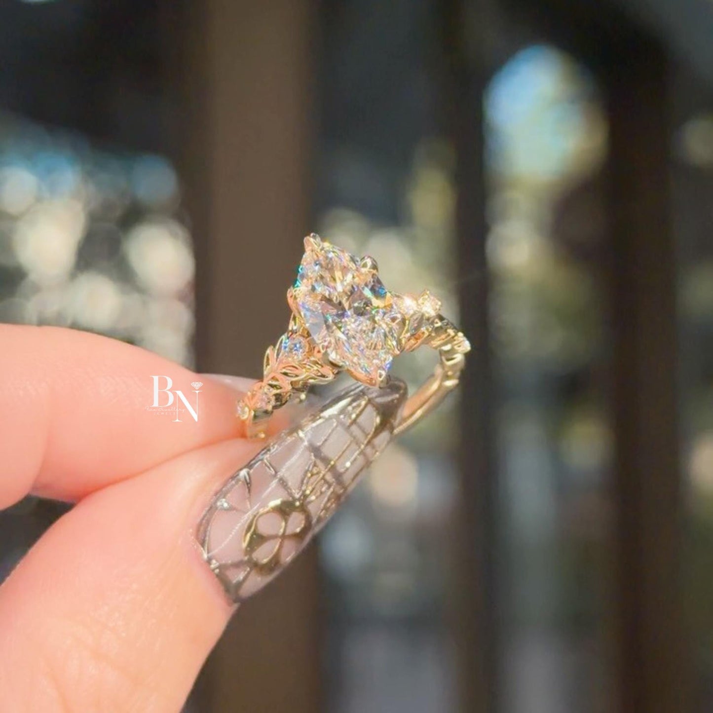 Exquisite 3.00ct marquise cut lab grown diamond engagement ring in 14k yellow gold. Features a dramatic, nature-inspired vine leaf floral band with marquise and round side accents. Romantic, high-set statement piece with an elongated cut.