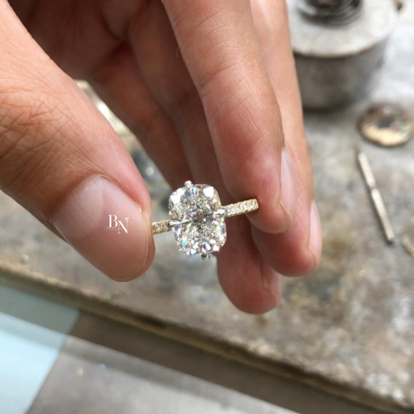 Exquisite 3.00ct elongated cushion cut lab grown diamond engagement ring. Set in 14k yellow gold with a secure prong setting and a delicate micro pave accent band. A luxurious, elongating, and sparkling solitaire ring.